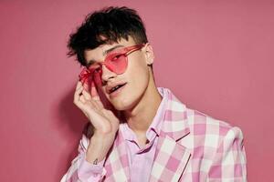 portrait of a young man plaid blazer pink glasses fashion modern style isolated background unaltered photo