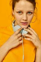 portrait of a young woman wearing headphones denim shorts close-up emotions cropped view unaltered photo