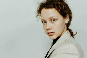 portrait of a young woman in a suit gestures with his hands emotions isolated backgrounds unaltered photo