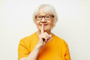 emotional elderly woman vision problems with glasses isolated background photo