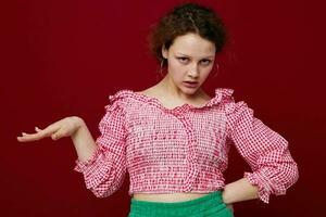 cheerful girl in pink buns gestures with her hands unaltered photo