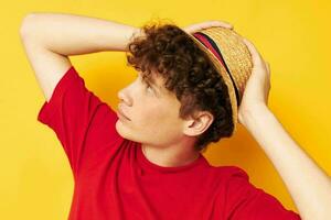 guy with red curly hair casual wear hat posing yellow background unaltered photo