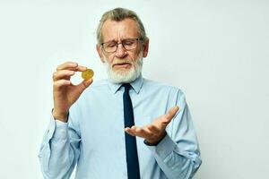 Photo of retired old man in a shirt with a tie Finance and Investments Bitcoin cropped view