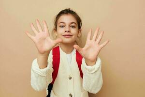 little girl schoolgirl with red backpack posing childhood unaltered photo