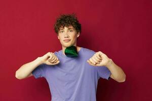 cute guy in purple t-shirt hat birthday party fun photo