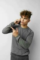 handsome young man technology with phone selfie isolated background photo