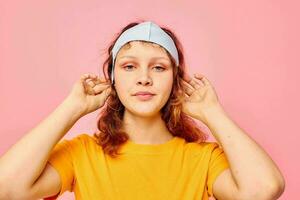 beautiful woman in a yellow t-shirt medical mask protection cropped view unaltered photo