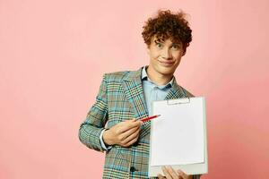 portrait of a young curly man in a business suit copy-space documents Lifestyle unaltered photo