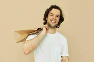 handsome man paper grocery bag posing Lifestyle unaltered photo