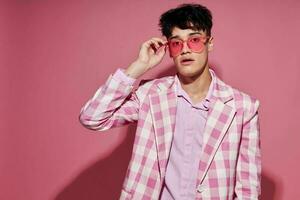 handsome guy self confidence pink plaid blazer fashion posing Lifestyle unaltered photo