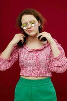 portrait of a girl in green shorts glasses with diamond headphones posing photo