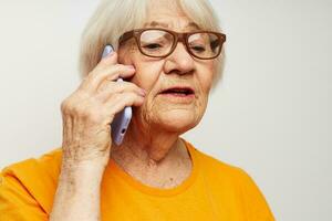 elderly woman happy lifestyle in yellow t-shirts close-up emotions photo