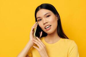 woman with Asian appearance communicates on the phone emotions Lifestyle unaltered photo