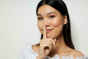 cute asian woman in white shirt posing fashion light background photo