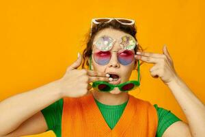 funny girl orange sweatshirts sunglasses multicolored glasses supply yellow background unaltered photo