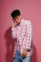 Photo of romantic young boyfriend pink shirt and glasses jacket fashion elegant style model studio