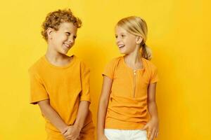 picture of positive boy and girl casual wear games fun together posing isolated background unaltered photo