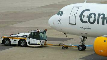 DUSSELDORF, GERMANY JULY 22, 2017 - Condor Airbus 320 D AICE towing before departure, Dusseldorf airport, Germany video