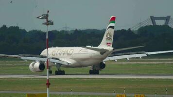 DUSSELDORF, GERMANY JULY 22, 2017 - Etihad Airbus 330 A6 EYS landing in Dusseldorf Airport, Germany video