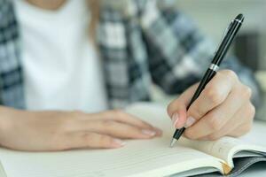 Student, use left-handed, inspiration, writer, writing ,creative ,recreation for imagine, writing ideas on notebook, to do list, good thinking work, journalist, Stylish, Dream image, relax, designer photo