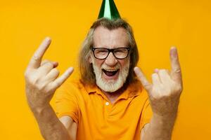 Portrait elderly man wearing glasses green cap on his head holiday emotions unaltered photo