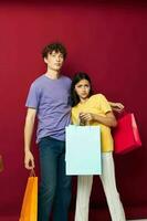 teenagers colorful bags shopping fun isolated background unaltered photo