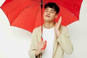 A young man rain protection in hand in hand modern style isolated background unaltered photo