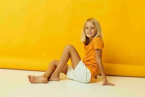 portrait of a little girl smile hand gestures posing casual wear fun isolated background unaltered photo