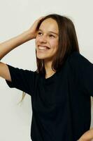 beautiful girl in a black t-shirt hand gesture fun isolated background photo