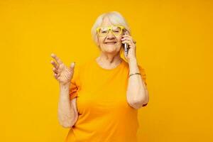 Photo of retired old lady fun talking on the phone close-up emotions