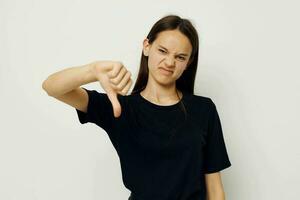 beautiful girl in a black t-shirt hand gesture fun isolated background photo