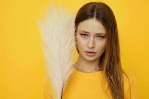 attractive woman posing pink feathers in hands charm fashion yeah Lifestyle unaltered photo