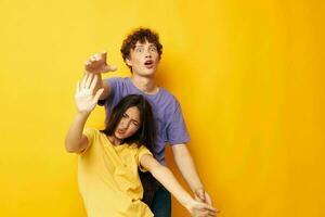 portrait of a man and a woman in colorful t-shirts posing friendship fun Lifestyle unaltered photo