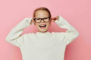 Portrait of happy smiling child girl white sweater posing fun isolated background photo