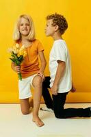 boy and girl with a bouquet of flowers friendship gift photo