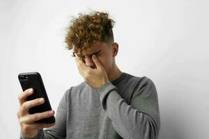 handsome guy talking on the phone posing emotions isolated background photo