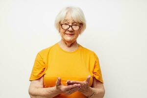 Portrait of an old friendly woman vision problems with glasses close-up photo