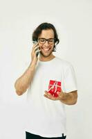 handsome man Red gift box telephone communication Lifestyle unaltered photo