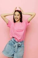 photo pretty woman pink glasses and t-shirt hand gesture pink background