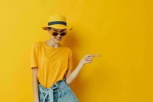 beautiful girl in a yellow hat Youth style casual wear in sunglasses Lifestyle unaltered photo