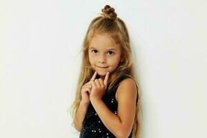 little girl in black shiny dress posing childhood photo