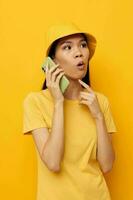 Portrait Asian beautiful young woman talking on the phone posing fashion isolated background unaltered photo