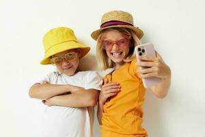 fashionable boy and girl wearing glasses posing phone entertainment photo