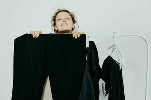 pretty woman in a suit gestures with his hands wardrobe yellow background unaltered photo