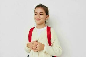 pretty young girl hand gesture red backpack childhood unaltered photo