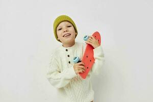 little girl in hats with a skateboard in their hands childhood unaltered photo