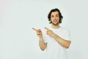 Attractive man in white t-shirt fashion cropped view light background photo