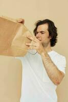 handsome man paper bag emotions posing Lifestyle unaltered photo
