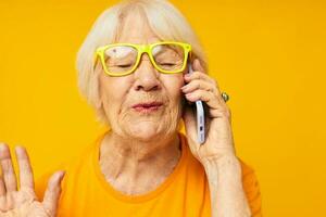 elderly woman fun talking on the phone close-up emotions photo