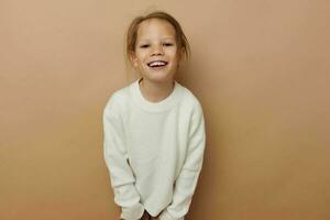 cute girl in white sweater posing hand gestures isolated background photo